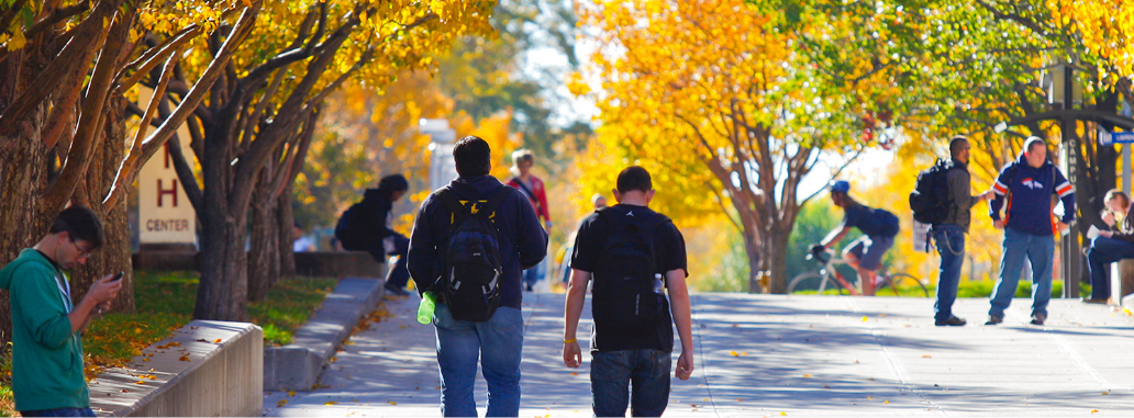 Photograph of People walking down a sidewalk on Auraria campus